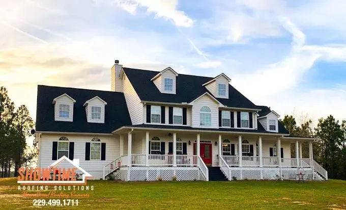 Two-story white house with a dark roof