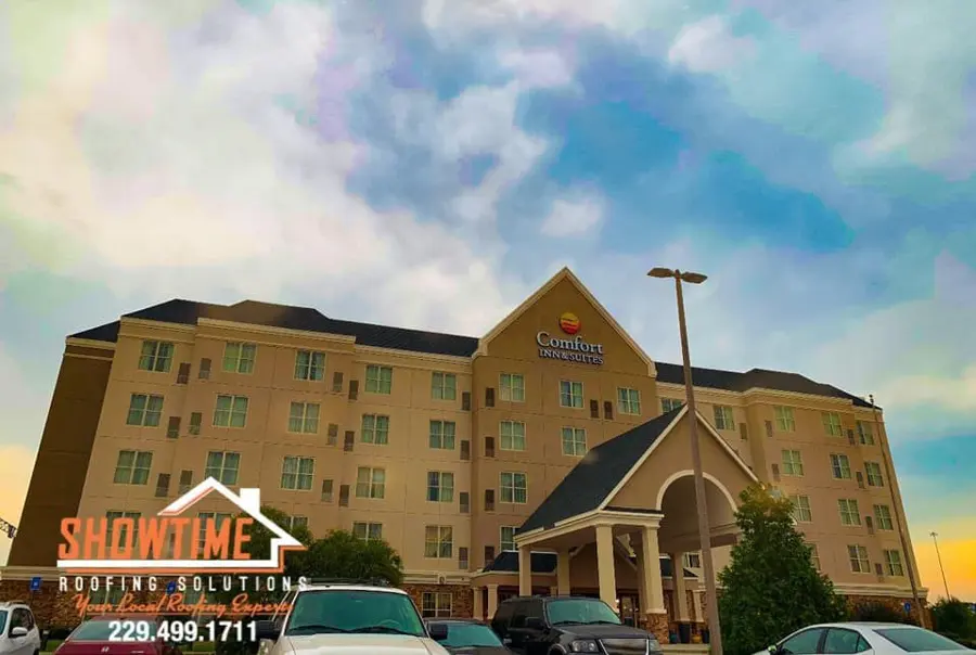 Multi-story hotel building with a dark roof